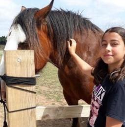 Photo of Lucy with a horse