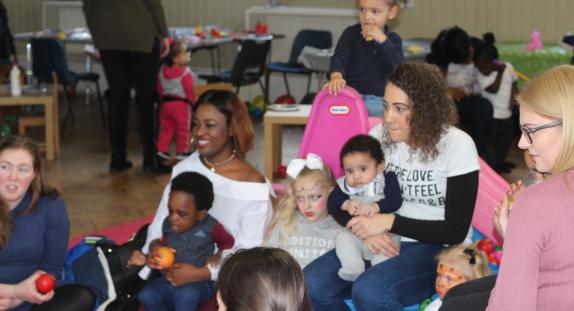 Young mums and babies in a room
