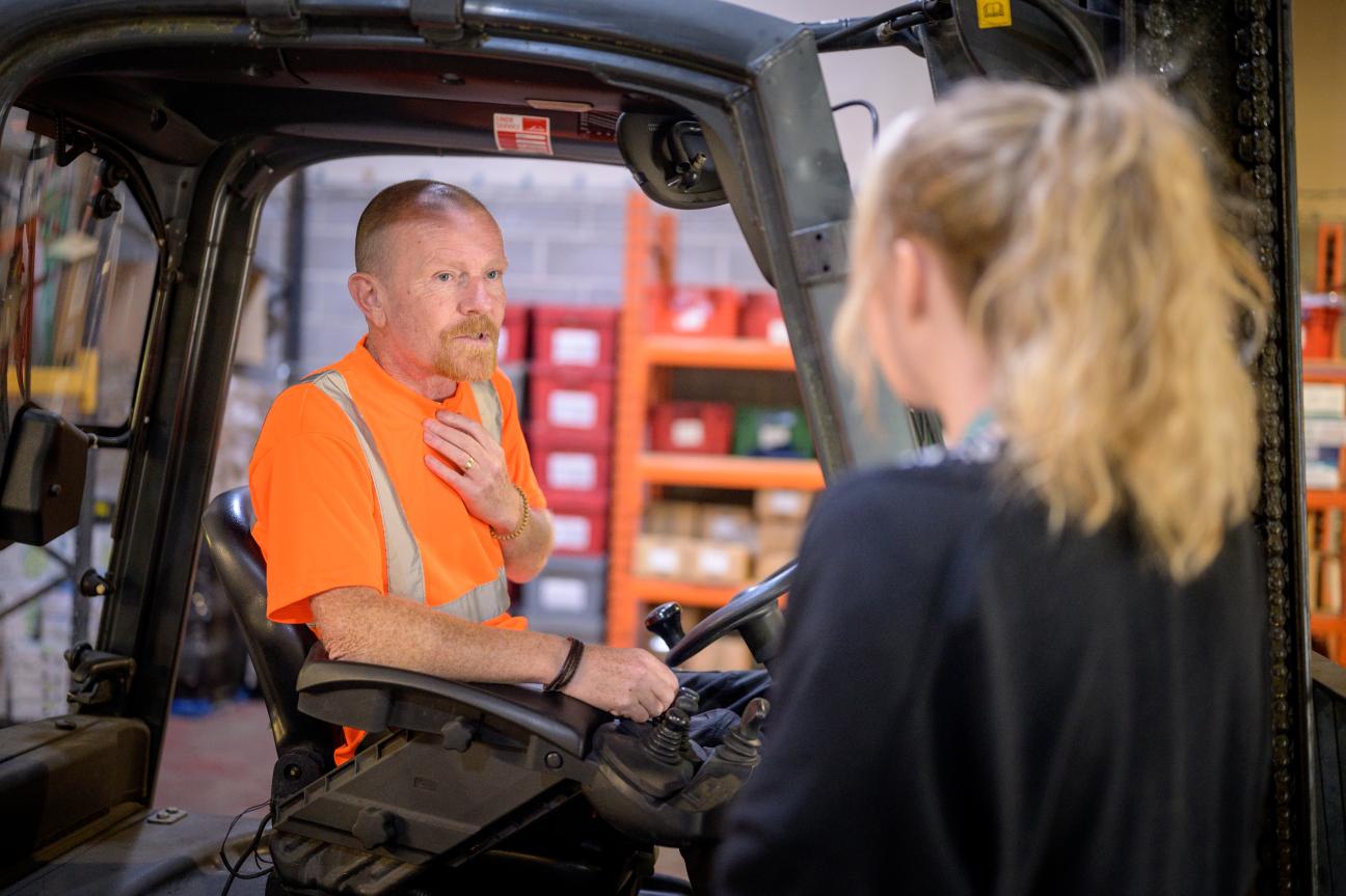 People working in a warehouse or a factory