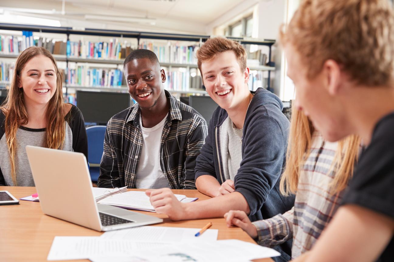 A group of students sitting at a table studying