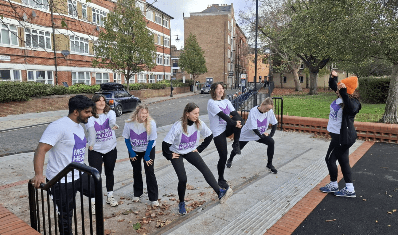A group of people warming up before exercise