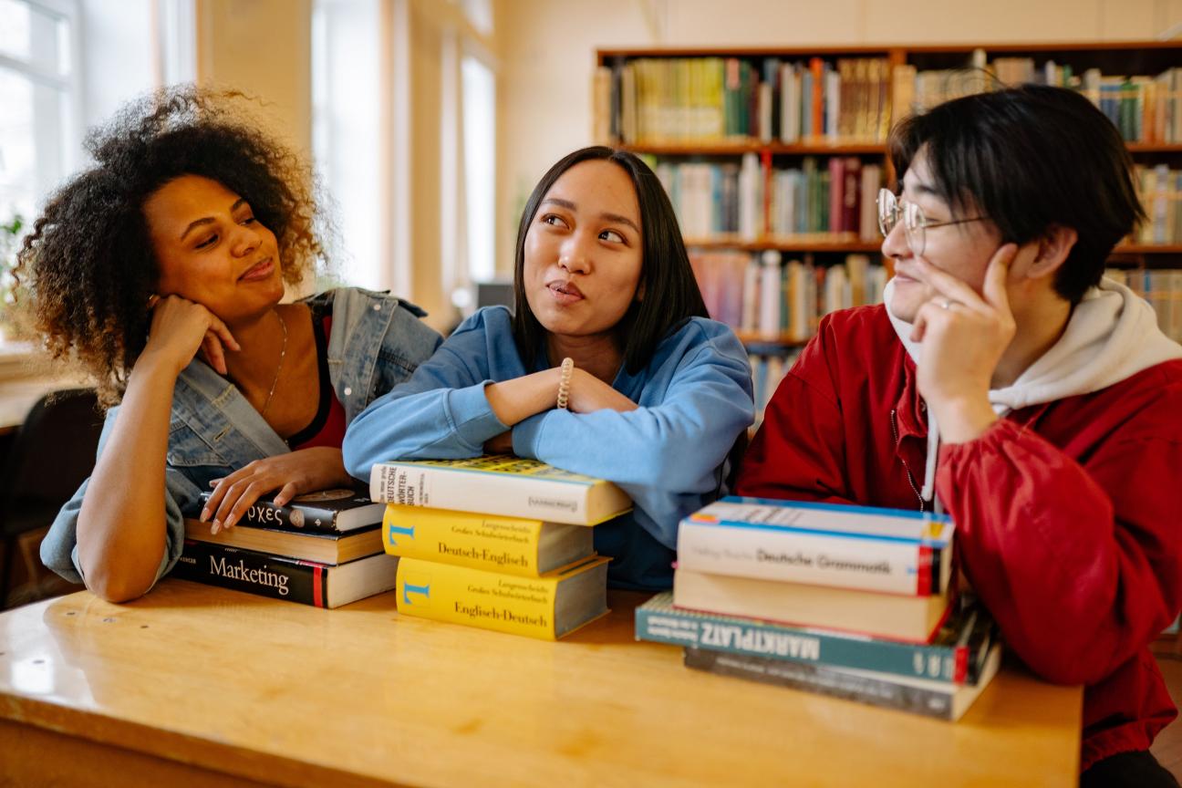 A group of university students studying at a table