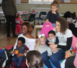 Young mums and babies in a room