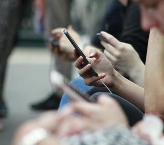 Lots of people using mobile phones