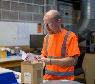 Man working with delivery package