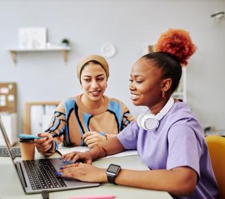 Two young women at work