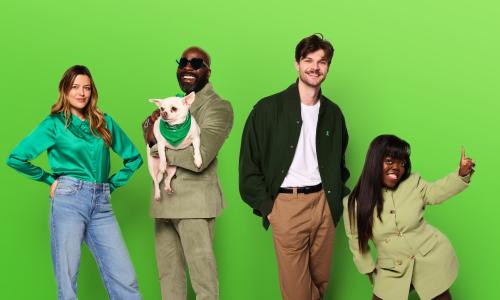 Several people lined up dressed in green against a green background