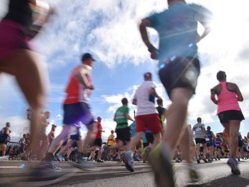 Image of people running past quickly
