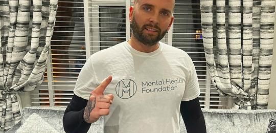 Photo of Taylor in a Mental Health Foundation tshirt