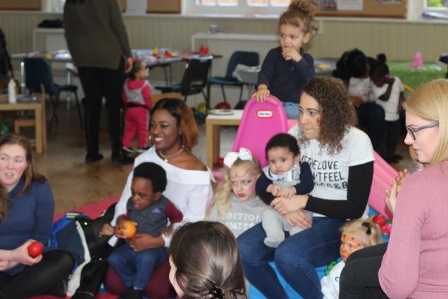Young mums and babies in a room