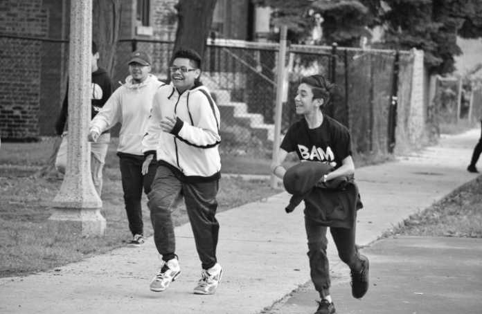Kids from the Becoming a Man (BAM) project running and playing