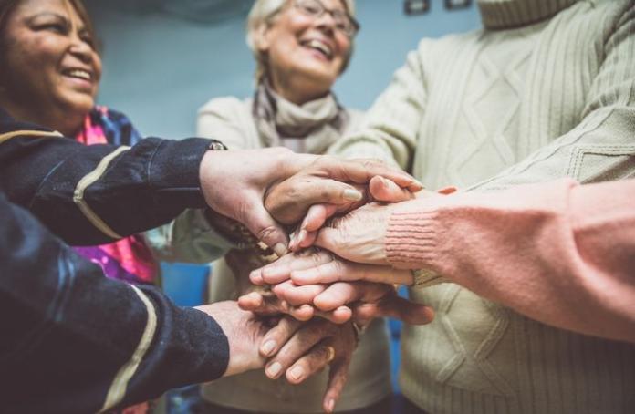 Group of elderly hands together