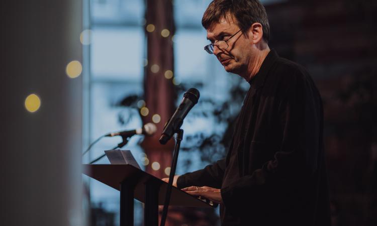 Man making a speech at a podium