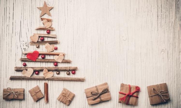 Image of a decorative Christmas tree with little gifts below it