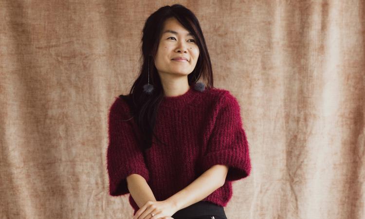 Woman sitting on a stool