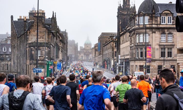Large crowd of runners in a street