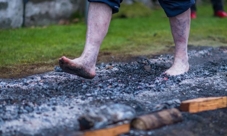 Closeup of someone's feet on the firewalk