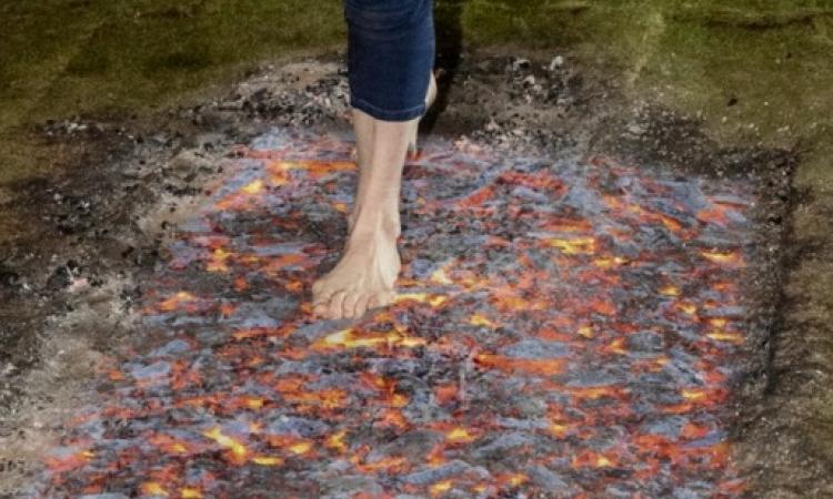 Closeup of someone walking on firewalk