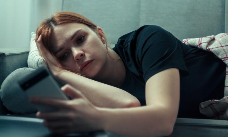 woman looking at her phone 