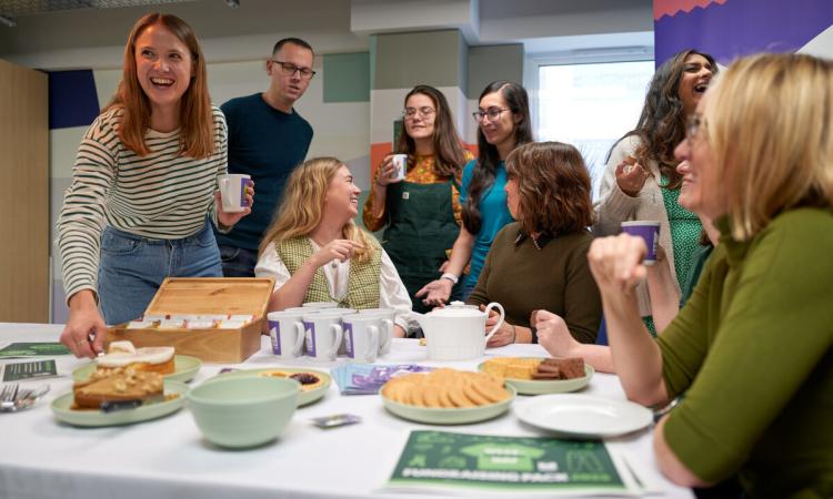 office workers gather together 