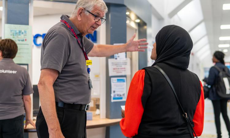 man in health clinic giving directions