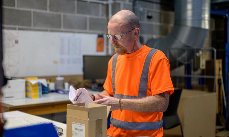 Man working with delivery package