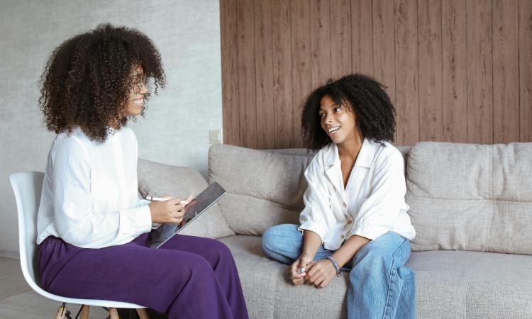 Two Black women having a conversation