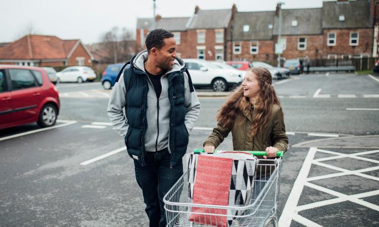 man and woman with shopping trolley