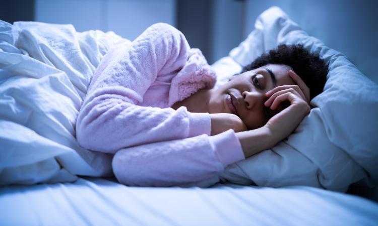 Woman in bed ready for sleep