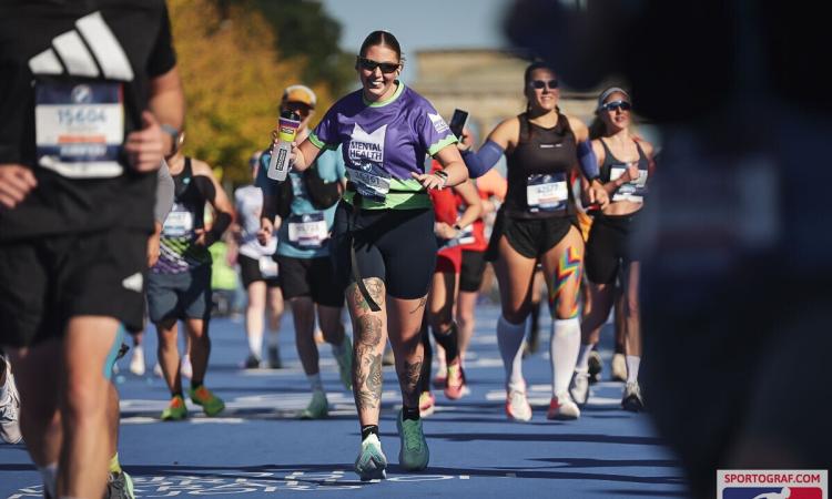 A Mental Health Foundation runner crosses the finish line at the Berlin Marathon