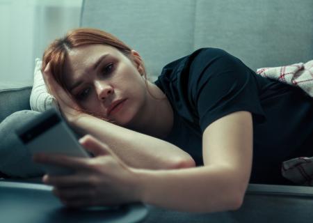 woman scrolling on her phone