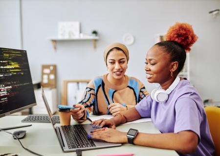 Two young women at work