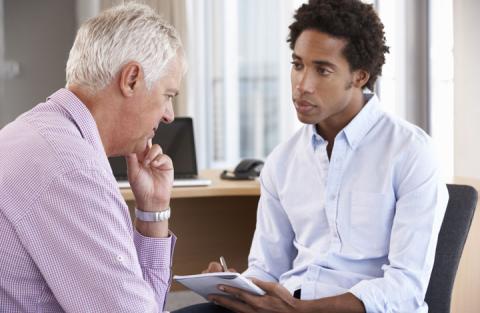 Someone speaking to a professional for help