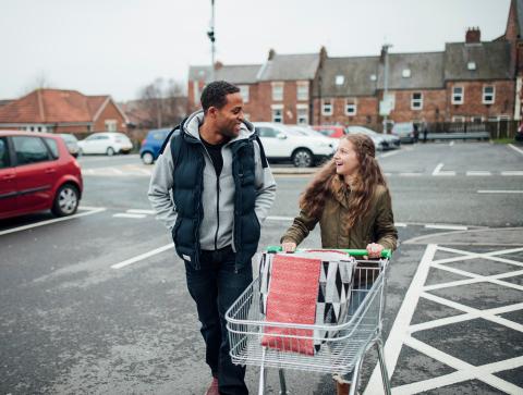 man and woman with shopping trolley