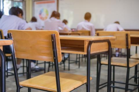 Classroom with empty desk and chair