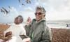 Women on the beach eating fish and chips