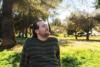 Man sitting outside in nature during the summer